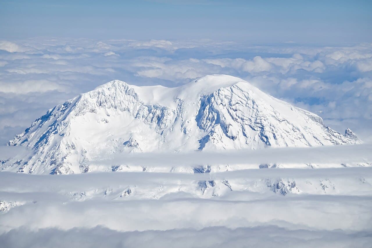 Mount Rainier rising above clouds in Washington State