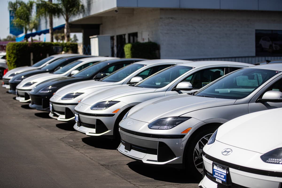 Cars lined up at a dealership lot